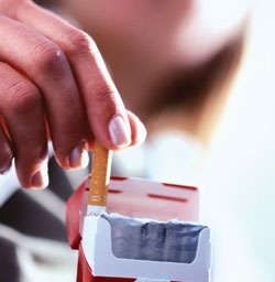 Cigarette being removed from pack