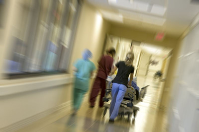 Doctors running in emergency room hall