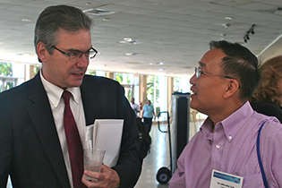 NIDA AIDS Research Program Director Jacques Normand, Ph.D., and Yu “Woody” Lin, Ph.D., NIDA Division of Clinical Neuroscience and Behavioral Research