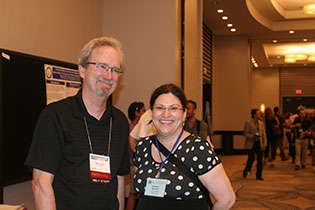 NIDA International Program Director Steven W. Gust, Ph.D., and Nathalie Gendron, Canadian Institutes of Health Research