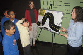 photo of teacher with students during brain awareness week