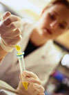 photo of woman researcher using a pipette