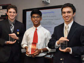 photograph of the Addiction Science Award winners, Kevin Knight, Ameya Deshmukh, and Joseph Yagoda, holding trophies