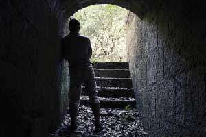 A man standing in a tunnel