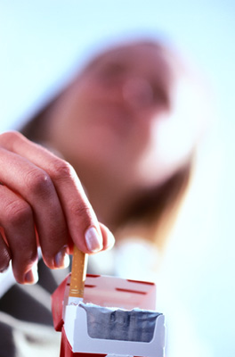 Photo of a Woman With Cigarettes