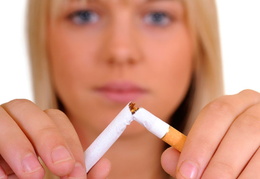 Image of woman breaking a cigarette