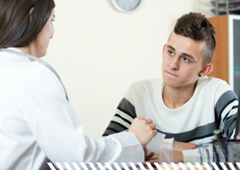 Image of teen talking with a health care professional