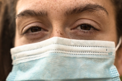 Close-up of woman wearing an N95 face mask.