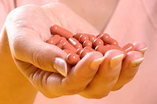 Hand holding pills