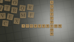 Scrabble tiles showing Aggression and Addiction intertwined